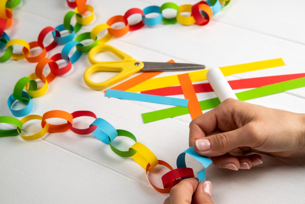 The Importance of Scissor Skills in Child Development: Tips and Activities to Get Started 4 assembling a paper chain